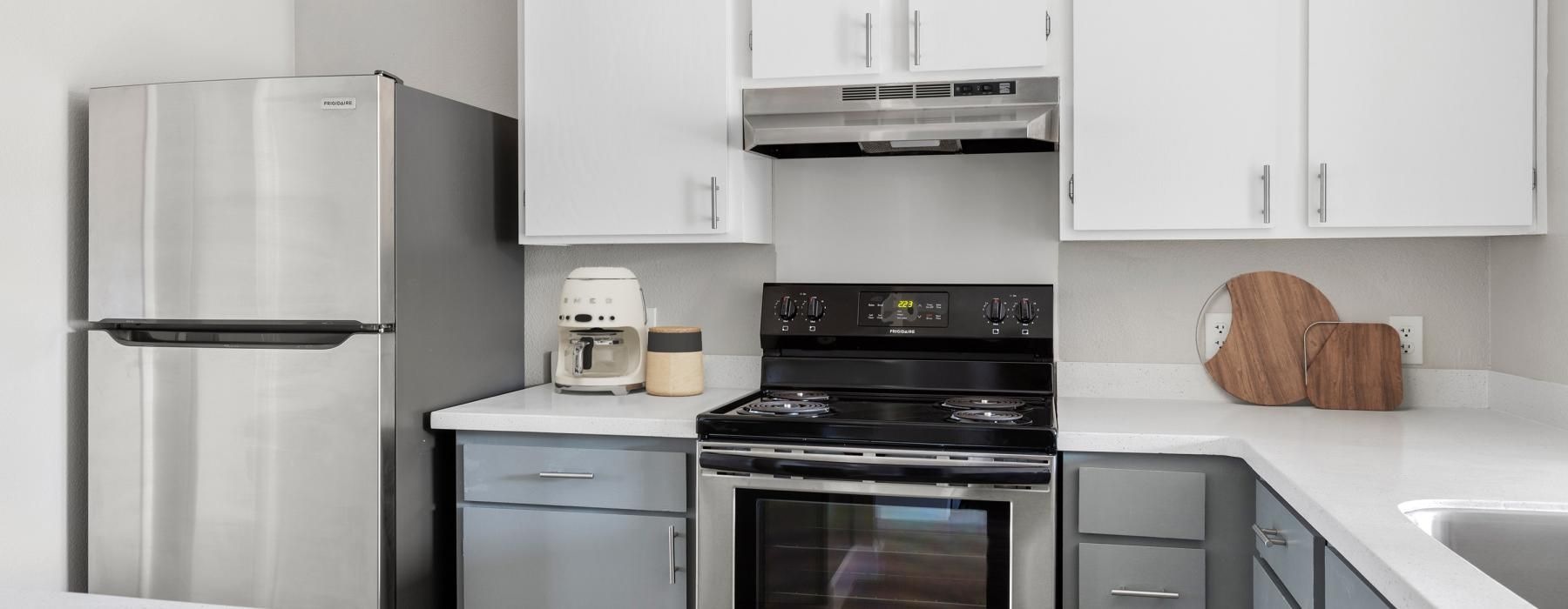 a kitchen with white cabinets