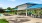 expansive poolside pavilion with tables and chairs