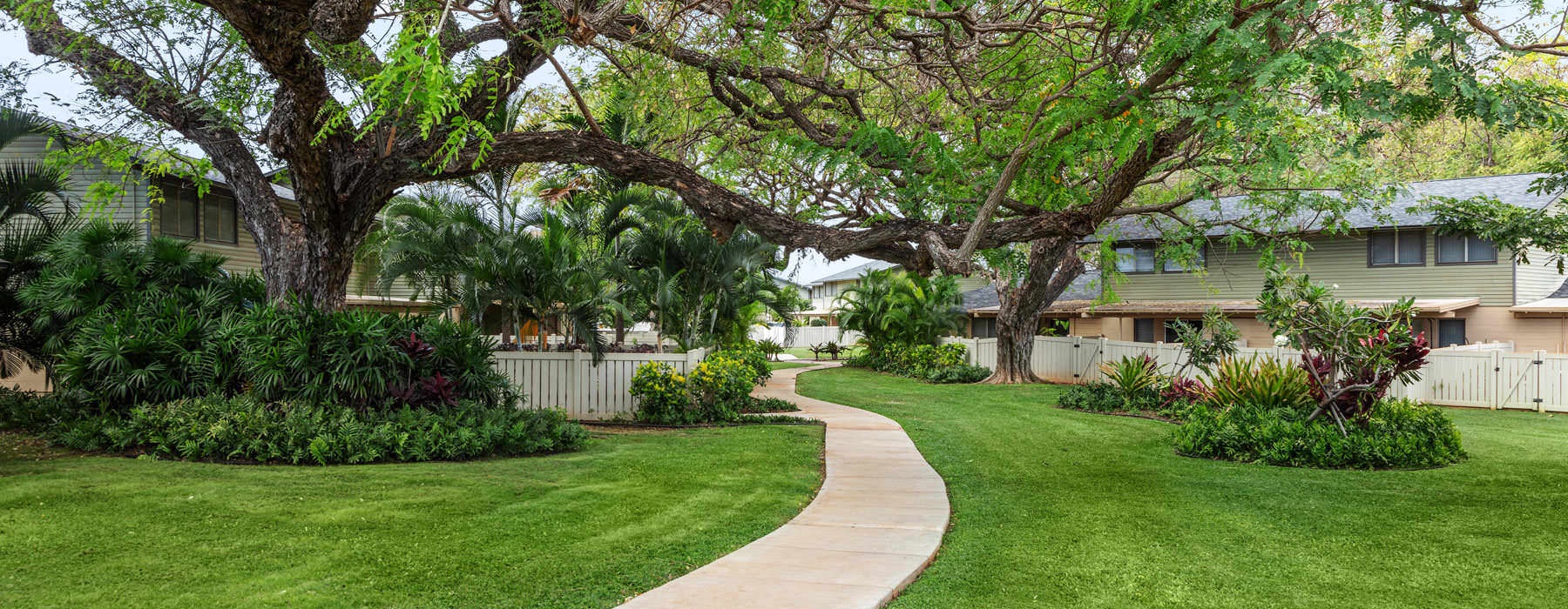 walking path along well manicured lawns and landscaping