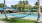 poolside hammock between palm trees